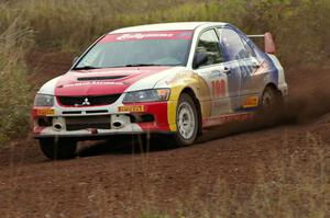 Arkadiusz Gruszka / Lukasz Wronski power through a corner on the practice stage in their Mitsubishi Lancer Evo 9.