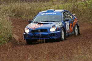 Tim Penasack / Alex Kihurani drift through a corner on the practice stage in their Subaru WRX.