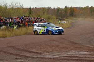 Travis Pastrana / Christian Edstrom throw their Subaru WRX STi hard into the spectator corner on Green Acres, SS1.