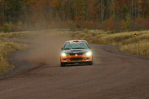 Andrew Comrie-Picard / Jeremy Wimpey at speed in their Mitsubishi Lancer Evo 9 into the spectator corner on Green Acres, SS1.