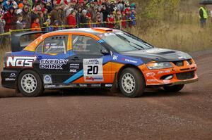 Andrew Comrie-Picard / Jeremy Wimpey drift their Mitsubishi Lancer Evo 9 through the spectator corner on Green Acres, SS1.