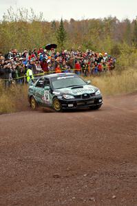 Mark Fox / Jake Blattner spray gravel at the spectator corner on Green Acres, SS1, in their Subaru WRX STi.