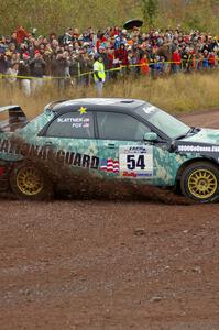 Mark Fox / Jake Blattner spray gravel at the spectator corner on Green Acres, SS1, in their Subaru WRX STi.