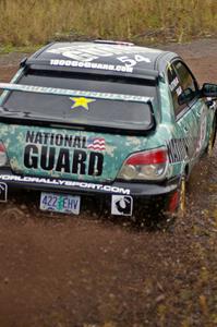 Mark Fox / Jake Blattner go wide at the spectator corner on Green Acres, SS1, in their Subaru WRX STi.