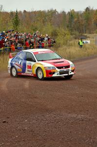 Arkadiusz Gruszka / Lukasz Wronski set up for the spectator corner on Green Acres, SS1, in their Mitsubishi Lancer Evo 9.