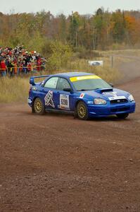 The Kenny Bartram / Dennis Hotson Subaru WRX STi goes past spectators on SS1, Green Acres.