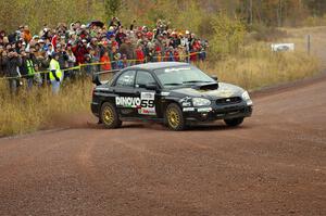 Pat Moro / Ole Holter set up for the spectator corner on Green Acres, SS1, in their Subaru WRX STi.