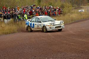 Henry Krolikowski / Cindy Krolikowski drift their Subaru Impreza through the spectator corner on Green Acres, SS1. (1)