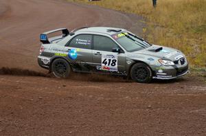 Jimmy Keeney / Missy Keeney drift through the spectator corner on Green Acres, SS1, in their Subaru WRX STi.