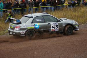 Jimmy Keeney / Missy Keeney blast out of the spectator corner on Green Acres, SS1, in their Subaru WRX STi.