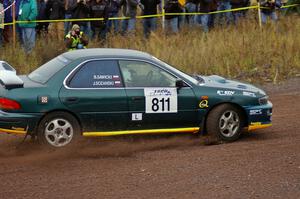 Jaroslaw Sozanski / Bartosz Sawicki drift their Subaru Impreza RS past the spectator point on Green Acres, SS1.