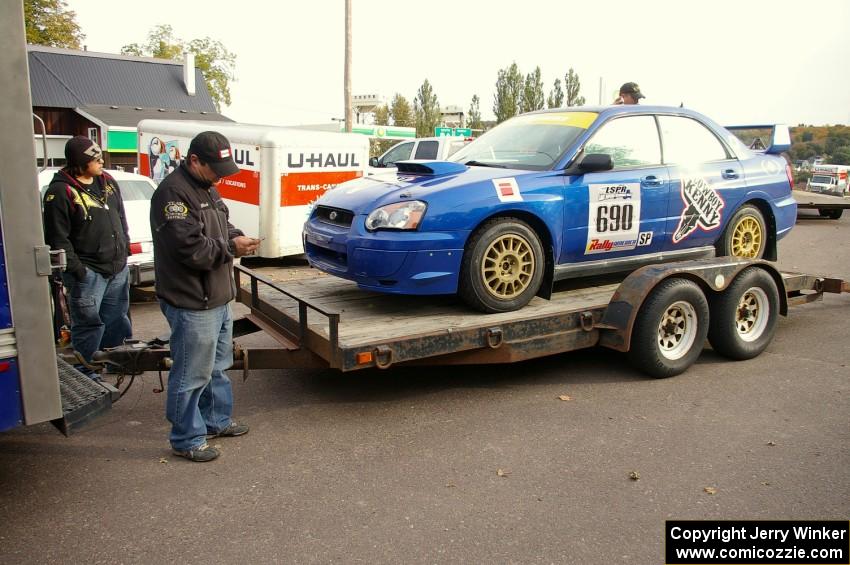 Micah Wiitala unloads the Kenny Bartram / Dennis Hotson Subaru WRX STi as Russ Johnson looks on.