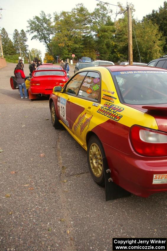 The Bryan Pepp / Jerry Stang Subaru WRX and Dustin Kasten / Corina Soto Subaru Impreza in the tech line.