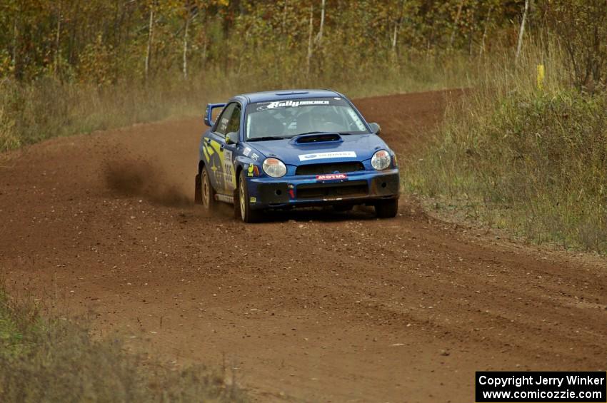 Janusz Topor / Michal Kaminski through a fast sweeper on the practice stage in their Subaru WRX STi.