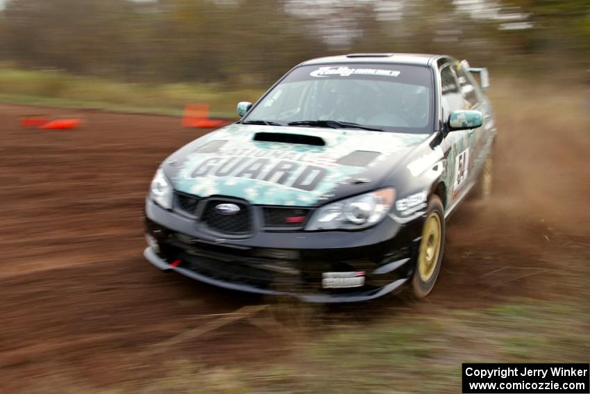 Mark Fox / Jake Blattner drift through a tight corner on the practice stage in their Subaru WRX STi.