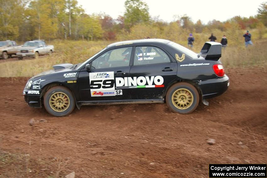 Pat Moro / Ole Holter drift through a tight corner on the practice stage in their Subaru WRX STi.