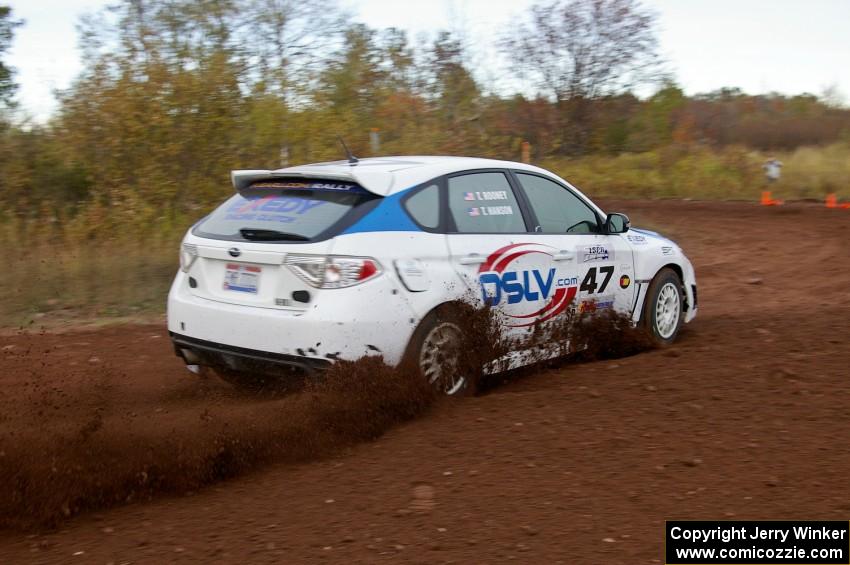 Tim Rooney / Travis Hanson drift their Subaru WRX Sti through a tight corner on the practice stage.