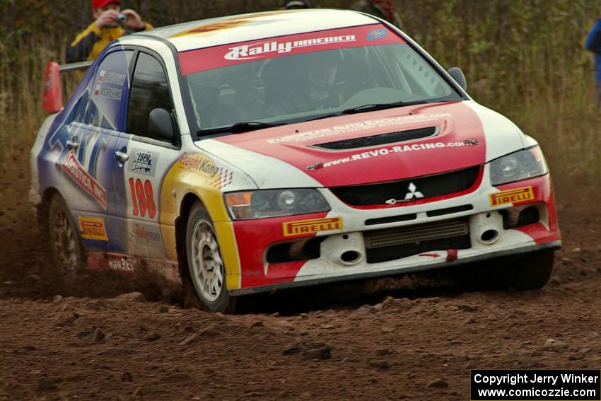 Arkadiusz Gruszka / Lukasz Wronski drift through a tight corner on the practice stage in their Mitsubishi Lancer Evo 9.