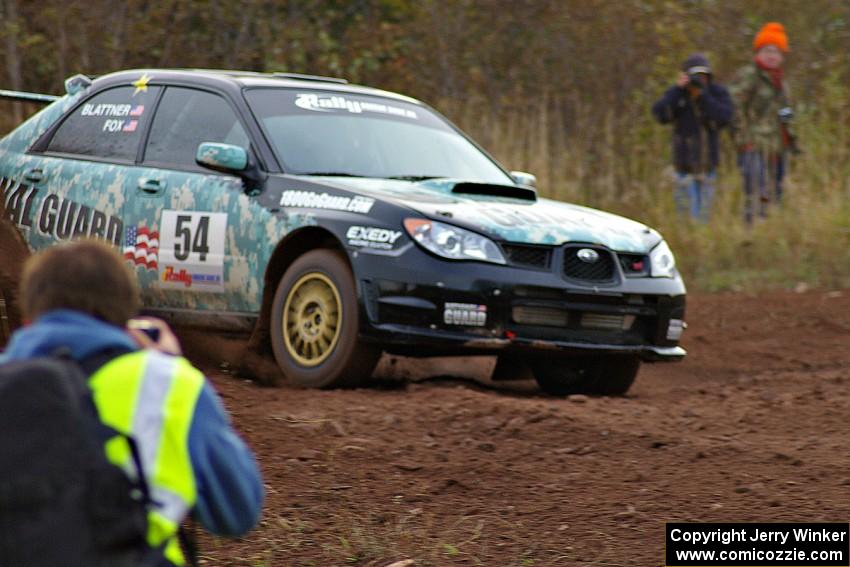 Lars Gagne takes a shot of the Mark Fox / Jake Blattner Subaru WRX STi at the practice stage.