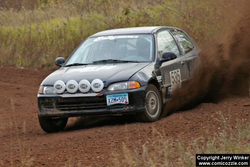 Silas Himes / Matt Himes power through a sweeper on the practice stage in their Honda Civic.