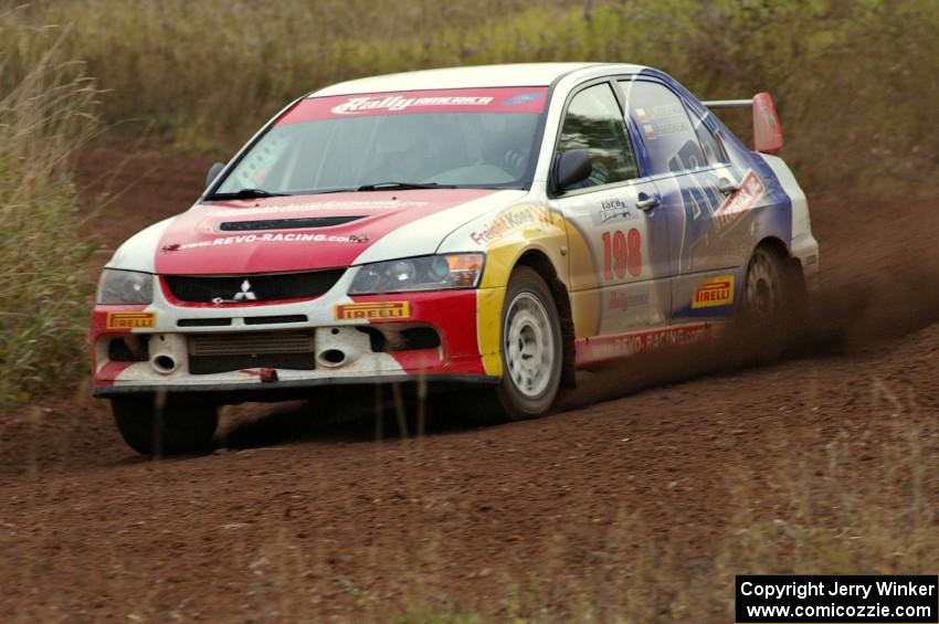 Arkadiusz Gruszka / Lukasz Wronski power through a corner on the practice stage in their Mitsubishi Lancer Evo 9.