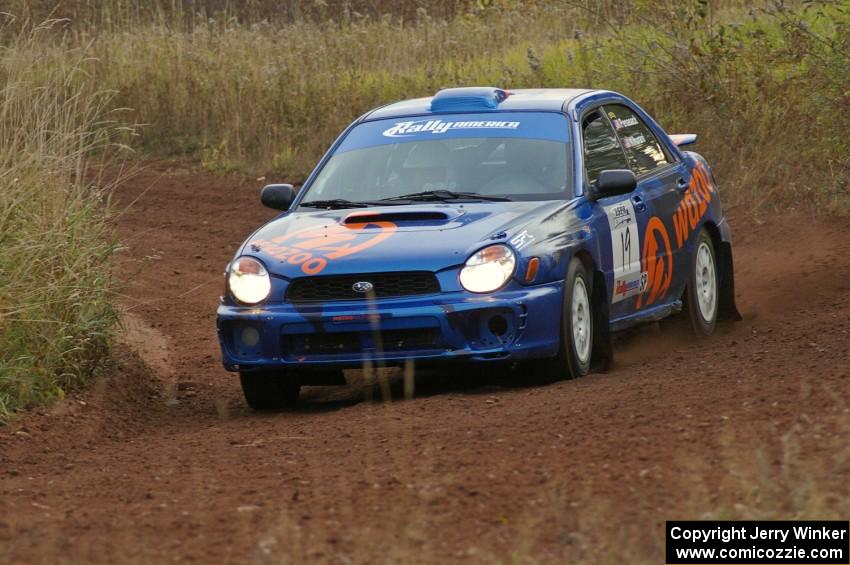 Tim Penasack / Alex Kihurani drift through a corner on the practice stage in their Subaru WRX.