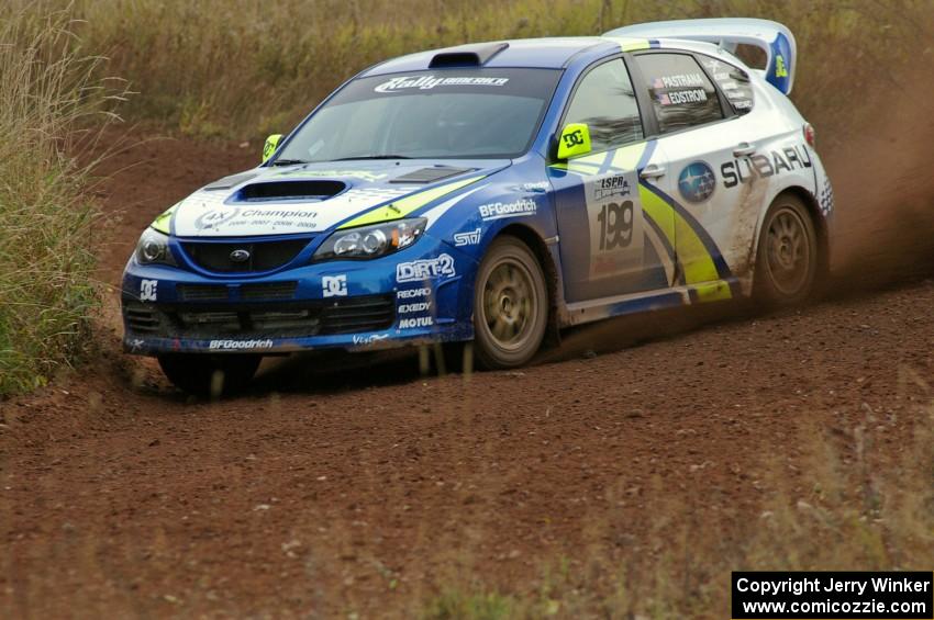 Travis Pastrana / Christian Edstrom drift their Subaru WRX STi hard through a tight corner on the practice stage.