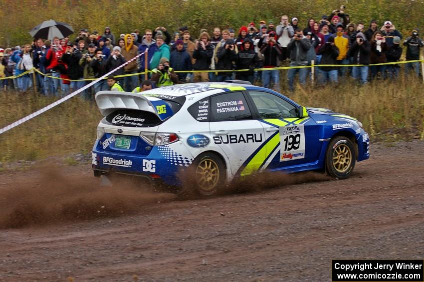 Travis Pastrana / Christian Edstrom blast out of the spectator corner on Green Acres, SS1, in their Subaru WRX STi.