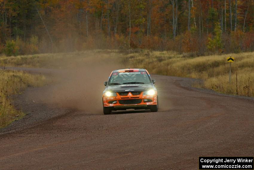 Andrew Comrie-Picard / Jeremy Wimpey at speed in their Mitsubishi Lancer Evo 9 into the spectator corner on Green Acres, SS1.