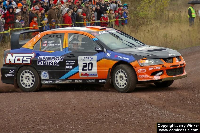 Andrew Comrie-Picard / Jeremy Wimpey drift their Mitsubishi Lancer Evo 9 through the spectator corner on Green Acres, SS1.