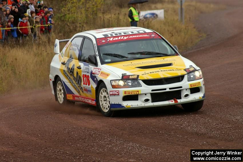 Andi Mancin / Maciej Wislawski drift hard in their Mitsubishi Lancer Evo 9 at the spectator corner on Green Acres, SS1.