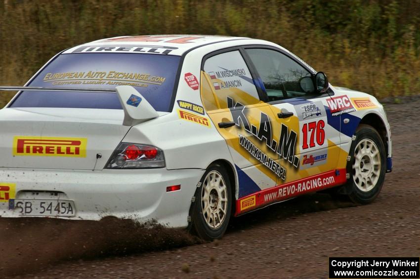 Andi Mancin / Maciej Wislawski hang it out in their Mitsubishi Lancer Evo 9 on the spectator corner on Green Acres, SS1.