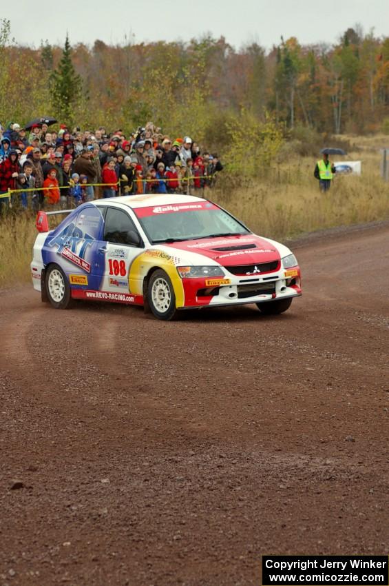 Arkadiusz Gruszka / Lukasz Wronski set up for the spectator corner on Green Acres, SS1, in their Mitsubishi Lancer Evo 9.