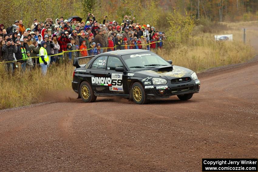 Pat Moro / Ole Holter set up for the spectator corner on Green Acres, SS1, in their Subaru WRX STi.