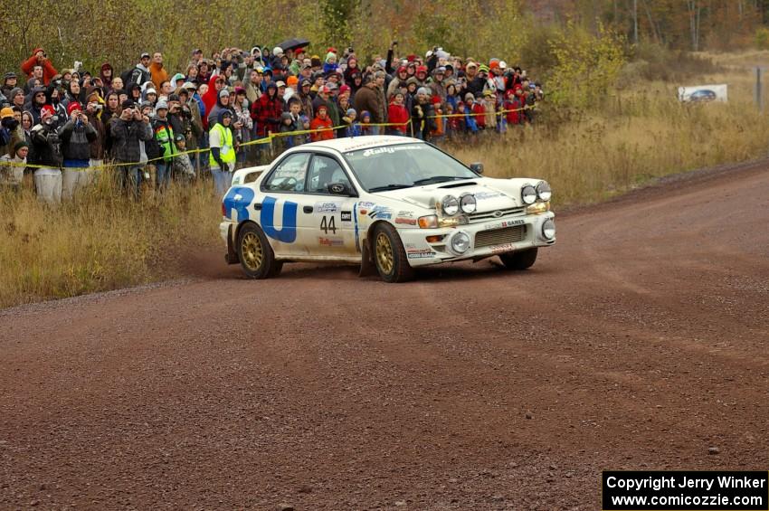 Henry Krolikowski / Cindy Krolikowski drift their Subaru Impreza through the spectator corner on Green Acres, SS1. (1)