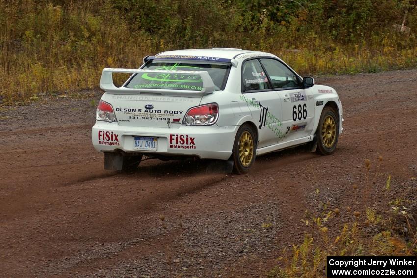 Heath Nunnemacher / Mike Rossey drift out of the spectator corner on Green Acres, SS1, in their Subaru WRX STi.