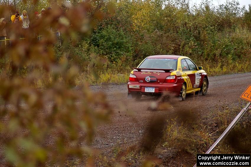 Bryan Pepp / Jerry Stang drive their Subaru WRX away from the spectator corner on Green Acres, SS1.