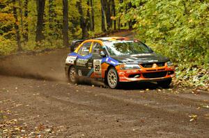 Andrew Comrie-Picard / Jeremy Wimpey drift their Mitsubishi Lancer Evo 9 through one of the last corners of Beacon Hill, SS2.