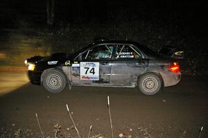 Vio Dobasu / Rob Amato at speed down a straight on Far Point 1, SS5, in their Subaru WRX STi.