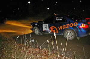 Tim Penasack / Alex Kihurani at speed on Far Point 1, SS5, in their Subaru WRX.