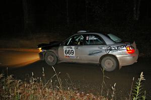 Evan Cline / Jason Grahn at speed down a straight on Far Point 1, SS5, in their Subaru Impreza.