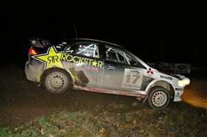 Antoine L'Estage / Nathalie Richard drift through the spectator corner on Far Point 2, SS7, in their Mitsubishi Lancer Evo X.