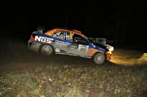 Andrew Comrie-Picard / Jeremy Wimpey drift their Mitsubishi Lancer Evo 9 through the spectator corner on Far Point 2, SS7.