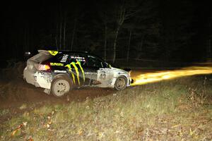 Ken Block / Alex Gelsomino drift through the spectator corner on Far Point 2, SS7, in their Subaru WRX STi.