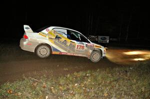 Andi Mancin / Maciej Wislawski drift through the spectator corner on Far Point 2, SS7, in their Mitsubishi Lancer Evo 9.