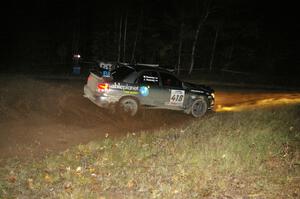 Jimmy Keeney / Missy Keeney at speed through the spectator corner on Far Point 2, SS7, in their Subaru WRX STi.