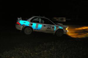 Henry Krolikowski / Cindy Krolikowski drift their Subaru Impreza through a 90-right on SS7, Far Point 2.