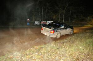 Vio Dobasu / Rob Amato drive through the spectator corner on Far Point 2, SS7, in their Subaru WRX STi.