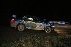Janusz Topor / Michal Kaminski drift their Subaru WRX STi through the spectator corner on Far Point 2, SS7.