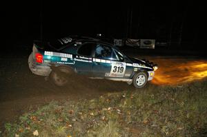 Chris Greenhouse / Don DeRose drift through the spectator corner on Far Point 2, SS7, in their Plymouth Neon.